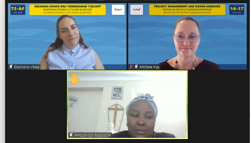 Participants including Baptisina engaging in discussion